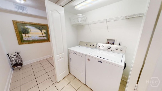 1609 Strand Ave Unit 306, Tybee Island, GA 31328 - laundry room with separate washer and dryer and light tile patterned floors