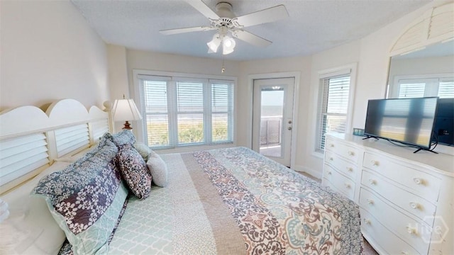 1609 Strand Ave Unit 306, Tybee Island, GA 31328 - carpeted bedroom with access to exterior and ceiling fan
