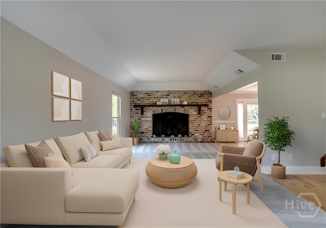 611 Benton Dr, Pooler, GA 31322 - living room with plenty of natural light, vaulted ceiling, wood finished floors, and a fireplace