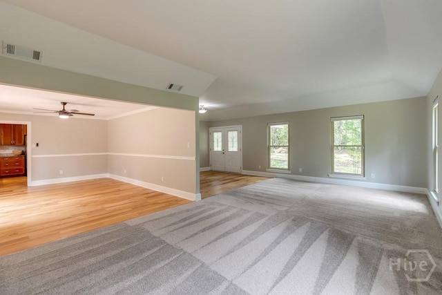 611 Benton Dr, Pooler, GA 31322 - spare room with light colored carpet, ceiling fan, and light wood-style floors
