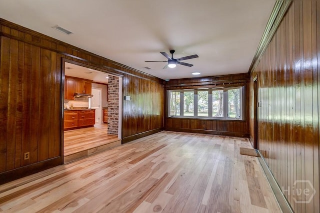611 Benton Dr, Pooler, GA 31322 - unfurnished room featuring wood walls, light wood-style floors, a ceiling fan, and crown molding