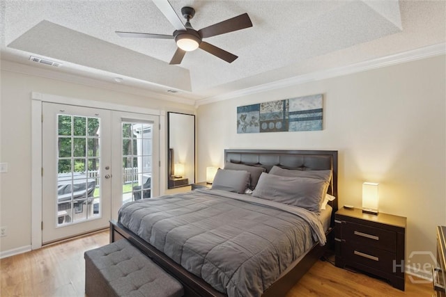 226 Silver Brook Cir, Pooler, GA 31322 - bedroom with crown molding, access to exterior, light wood-style floors, french doors, and a textured ceiling