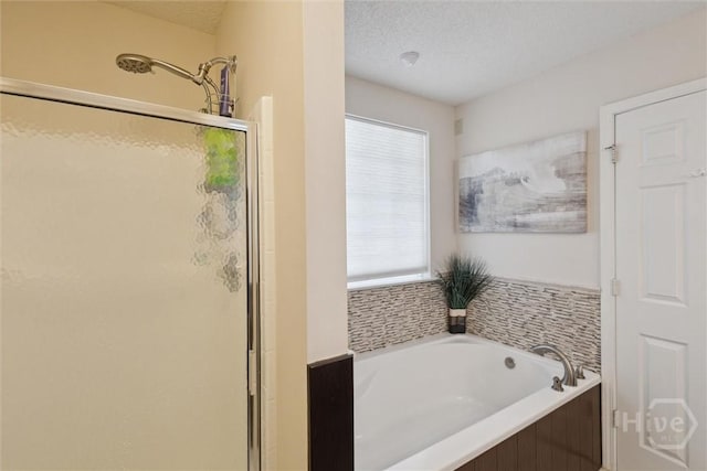 226 Silver Brook Cir, Pooler, GA 31322 - full bath featuring a stall shower, a garden tub, and a textured ceiling