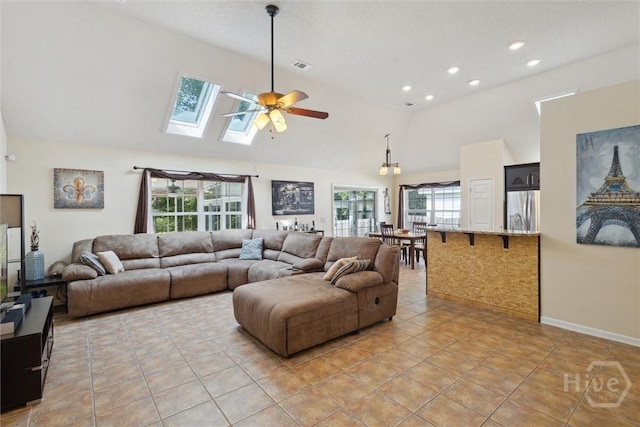 226 Silver Brook Cir, Pooler, GA 31322 - living area with ceiling fan, a skylight, plenty of natural light, light tile patterned flooring, and high vaulted ceiling