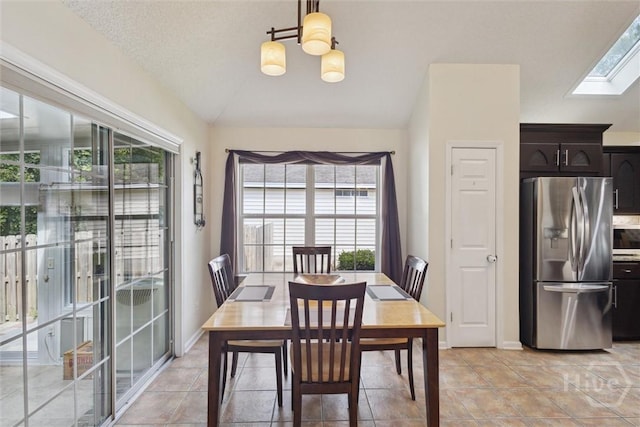 226 Silver Brook Cir, Pooler, GA 31322 - dining room with lofted ceiling, healthy amount of natural light, a chandelier, a skylight, and light tile patterned floors