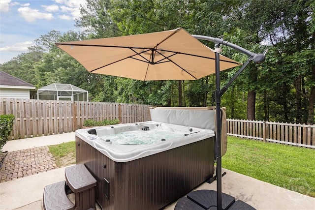 226 Silver Brook Cir, Pooler, GA 31322 - fenced backyard featuring a hot tub, view of wooded area, and a patio