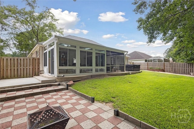 226 Silver Brook Cir, Pooler, GA 31322 - back of property with a sunroom, a fenced backyard, and a patio area