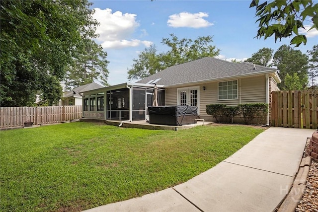 226 Silver Brook Cir, Pooler, GA 31322 - back of house with a hot tub, a sunroom, a fenced backyard, roof with shingles, and a patio