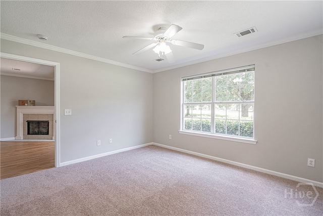 76 Al Henderson Blvd Unit G-4, Savannah, GA 31419 - carpeted empty room featuring a ceiling fan, crown molding, a tile fireplace, and a smoke detector