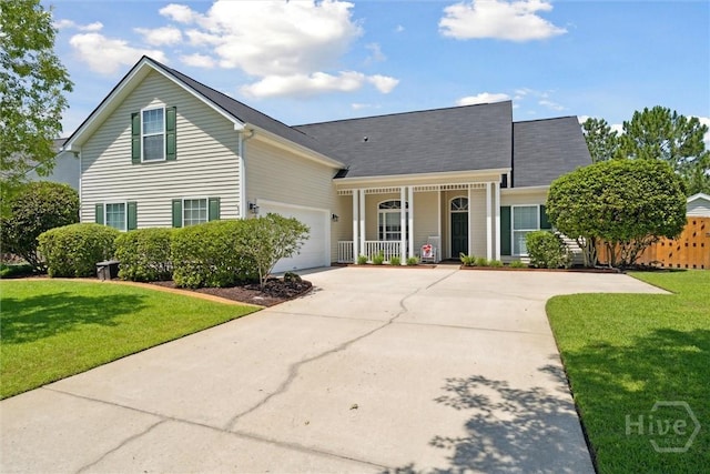 7 River Rock Rd, Savannah, GA 31419 - view of front facade with covered porch, driveway, a front lawn, and an attached garage