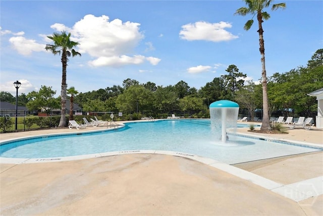 7 River Rock Rd, Savannah, GA 31419 - community pool featuring a patio area and view of wooded area