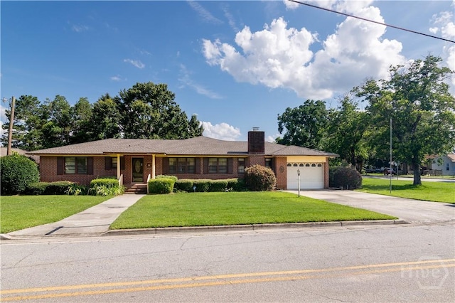 401 E Smith St, Claxton, GA 30417 - ranch-style house with driveway, an attached garage, a front lawn, and brick siding