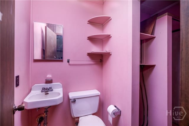 401 E Smith St, Claxton, GA 30417 - bathroom with toilet and a sink
