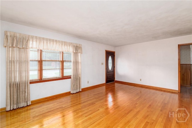401 E Smith St, Claxton, GA 30417 - unfurnished room with baseboards and light wood-type flooring