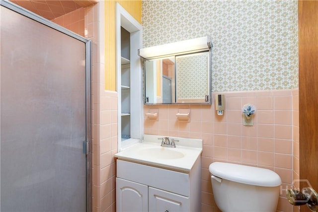 401 E Smith St, Claxton, GA 30417 - bathroom with vanity, a stall shower, wallpapered walls, and tile walls