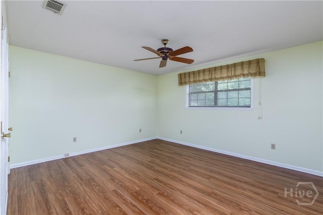 401 E Smith St, Claxton, GA 30417 - spare room with a ceiling fan and wood finished floors