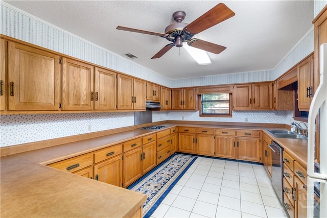 401 E Smith St, Claxton, GA 30417 - kitchen featuring light tile patterned floors, crown molding, brown cabinetry, a ceiling fan, and stainless steel appliances