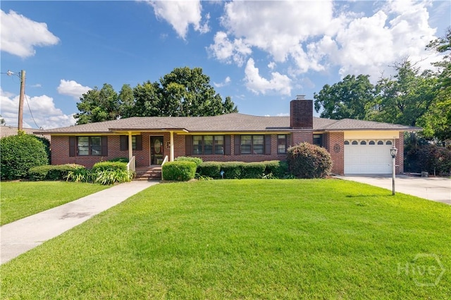 401 E Smith St, Claxton, GA 30417 - ranch-style house with brick siding, concrete driveway, a front lawn, a garage, and a chimney