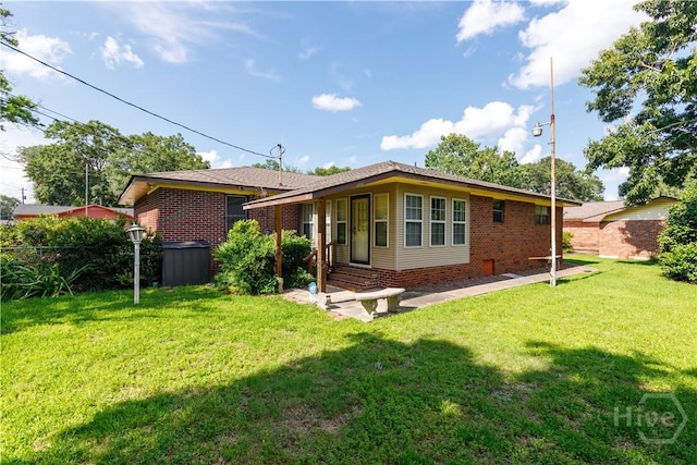 401 E Smith St, Claxton, GA 30417 - rear view of property featuring brick siding