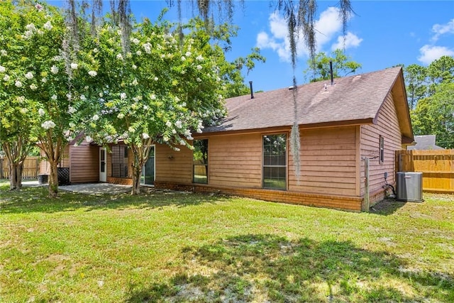 2 Brandle Cv, Savannah, GA 31405 - back of property with a shingled roof and a patio area