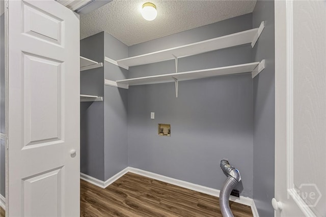 2 Brandle Cv, Savannah, GA 31405 - laundry area featuring dark wood-style flooring, a textured ceiling, and hookup for a washing machine