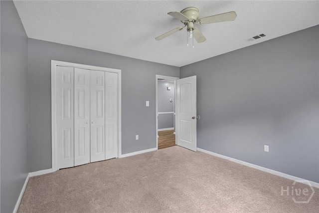 2 Brandle Cv, Savannah, GA 31405 - unfurnished bedroom with carpet floors, a closet, and a ceiling fan