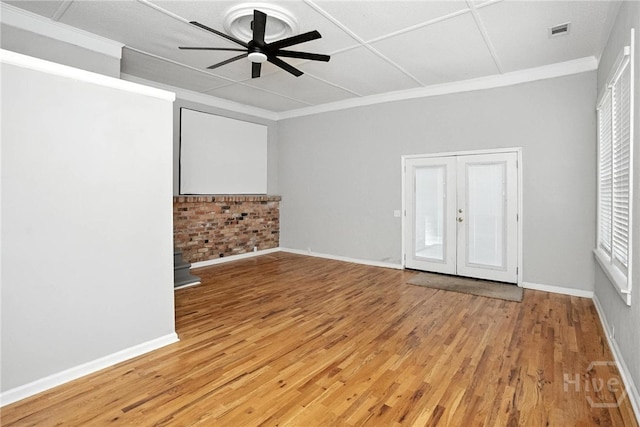 7423 Central Ave, Savannah, GA 31406 - unfurnished bedroom featuring light wood-style floors, french doors, ornamental molding, and a ceiling fan