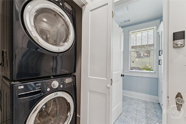 1405 E 51st St, Savannah, GA 31404 - laundry area featuring stacked washer and clothes dryer and tile patterned floors