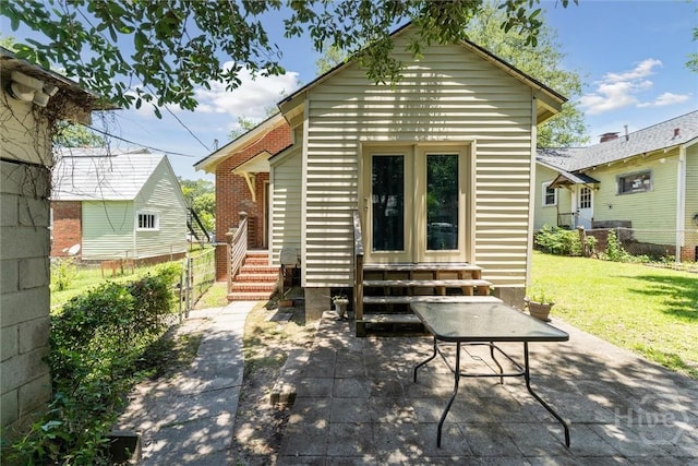 1405 E 51st St, Savannah, GA 31404 - back of property with entry steps and a patio