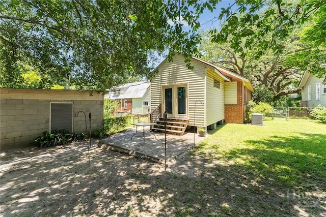 1405 E 51st St, Savannah, GA 31404 - rear view of property featuring entry steps and a patio area