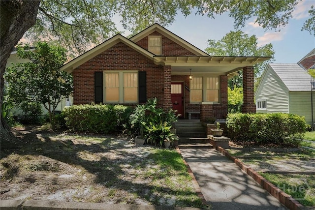 1405 E 51st St, Savannah, GA 31404 - view of front of home featuring brick siding and a porch