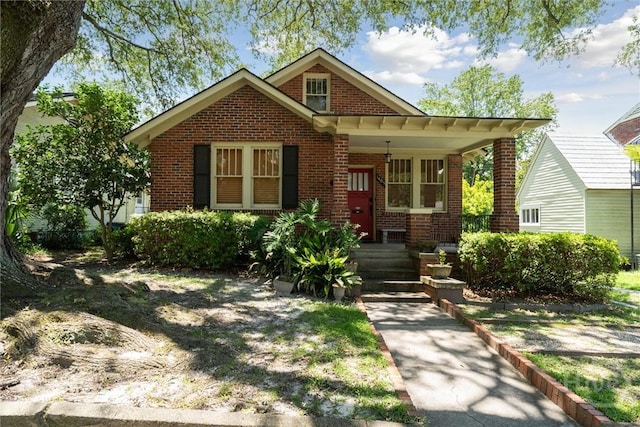 1405 E 51st St, Savannah, GA 31404 - bungalow-style house featuring brick siding and a porch
