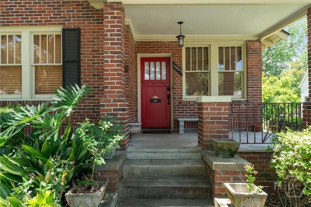 1405 E 51st St, Savannah, GA 31404 - doorway to property with brick siding and covered porch