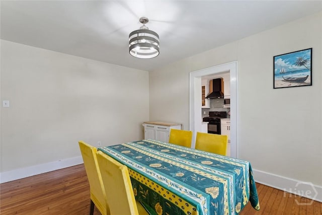 1405 E 51st St, Savannah, GA 31404 - dining space with baseboards and wood finished floors