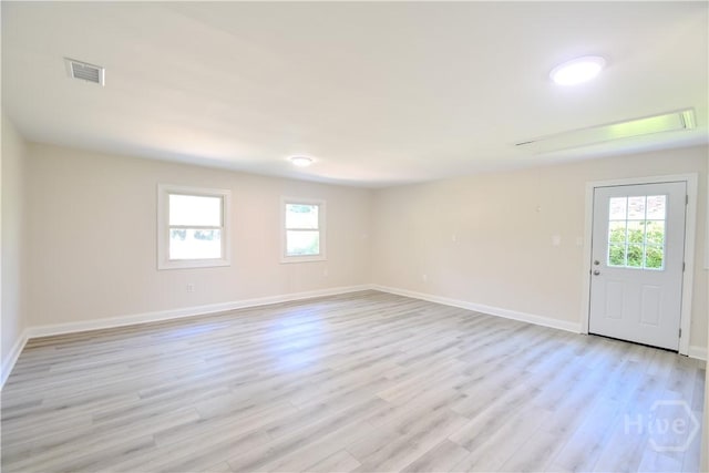 1003 Lora St, Savannah, GA 31410 - spare room with healthy amount of natural light, light wood-style flooring, and attic access