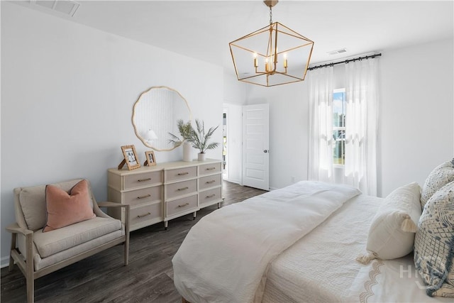 143 Crimson Ln, Savannah, GA 31302 - bedroom with a chandelier and dark wood finished floors