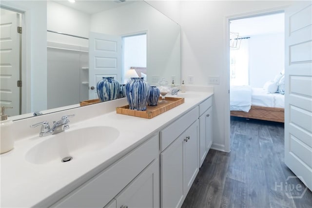 143 Crimson Ln, Savannah, GA 31302 - ensuite bathroom with double vanity and wood finished floors