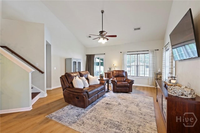 28 Cross Gate Ct, Pooler, GA 31322 - living room with wood finished floors, a ceiling fan, high vaulted ceiling, and stairs