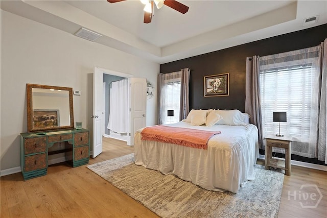28 Cross Gate Ct, Pooler, GA 31322 - bedroom with a raised ceiling, light wood-style floors, and a ceiling fan