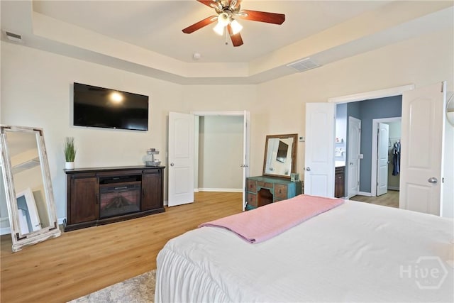 28 Cross Gate Ct, Pooler, GA 31322 - bedroom featuring wood finished floors, a raised ceiling, and a ceiling fan