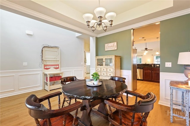 28 Cross Gate Ct, Pooler, GA 31322 - dining room featuring a chandelier, a wainscoted wall, light wood-type flooring, crown molding, and a ceiling fan