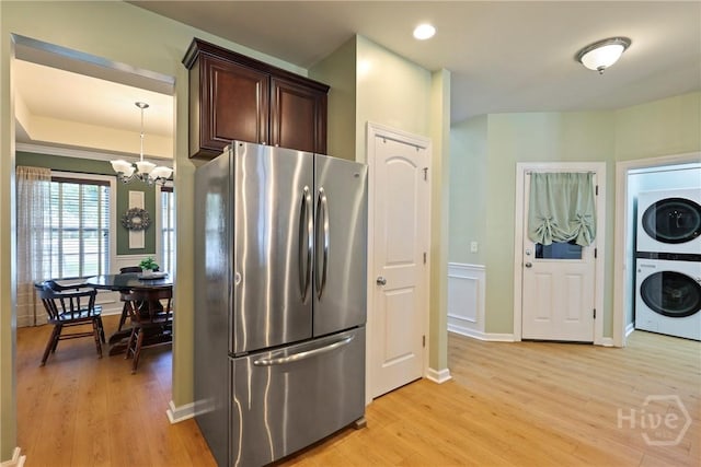 28 Cross Gate Ct, Pooler, GA 31322 - kitchen with freestanding refrigerator, estacked washer and dryer, a chandelier, light wood-style floors, and recessed lighting