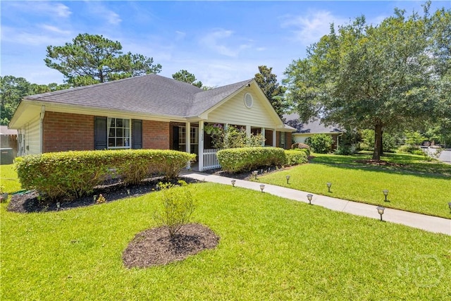 135 Trellis Way, Savannah, GA 31419 - view of front of house featuring a front yard, brick siding, and a shingled roof