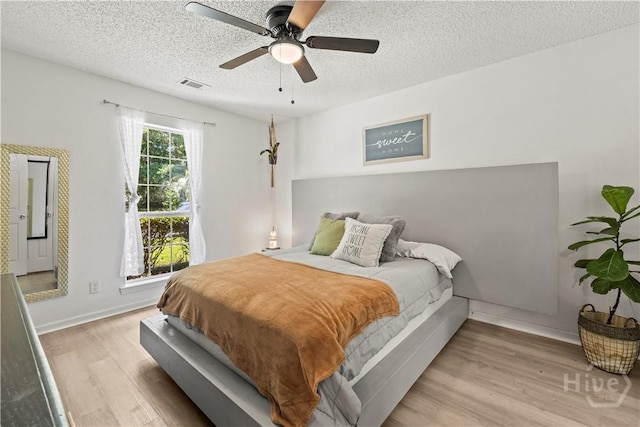 135 Trellis Way, Savannah, GA 31419 - bedroom with wood finished floors, a textured ceiling, and ceiling fan