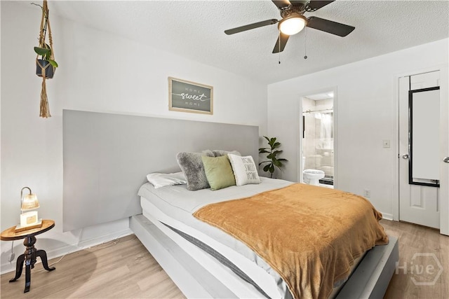 135 Trellis Way, Savannah, GA 31419 - bedroom with light wood-style flooring, a textured ceiling, ensuite bath, and a ceiling fan