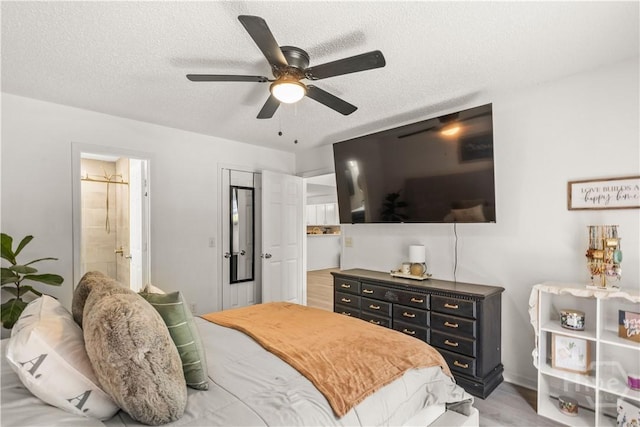 135 Trellis Way, Savannah, GA 31419 - bedroom featuring ceiling fan, a textured ceiling, ensuite bath, and light wood-type flooring