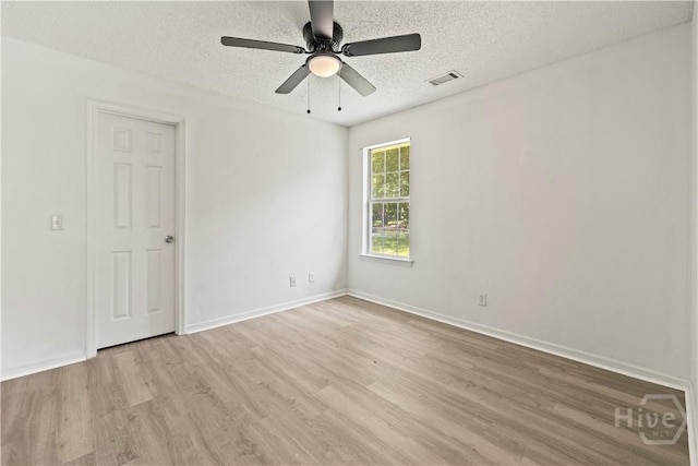 135 Trellis Way, Savannah, GA 31419 - spare room with light wood-style flooring, a textured ceiling, and ceiling fan