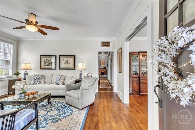 217 E 54th St, Savannah, GA 31405 - living room with ornamental molding, ceiling fan, and wood finished floors