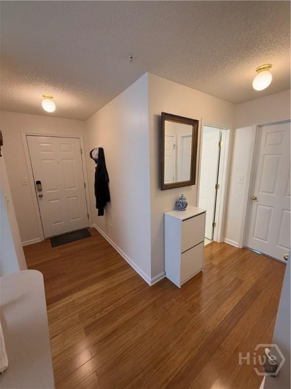 9307 Walden Park Dr, Savannah, GA 31410 - foyer entrance with a textured ceiling and wood finished floors