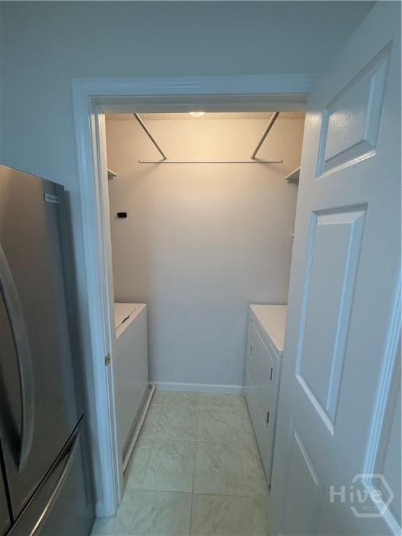 9307 Walden Park Dr, Savannah, GA 31410 - laundry room with separate washer and dryer and baseboards